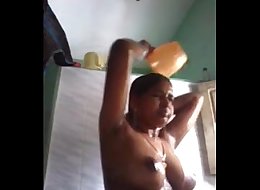 Indian girl taking self video when bathing